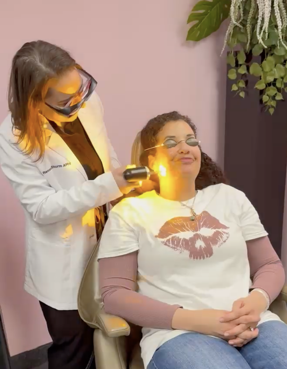 Renee Storm, APRN, performing an AdvaTx laser treatment on a patient